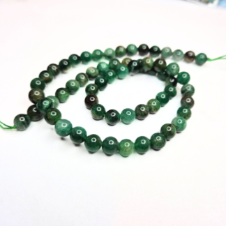 En sträng fuchsit 6,5 mm (ca 63 pärlor) (82041)